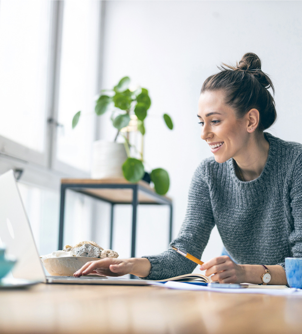 A woman working independently at her desk