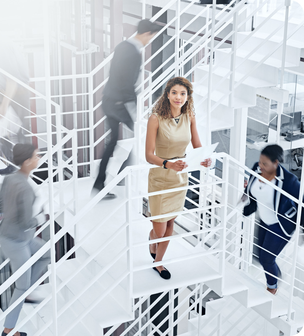 Professional standing on a white staircase